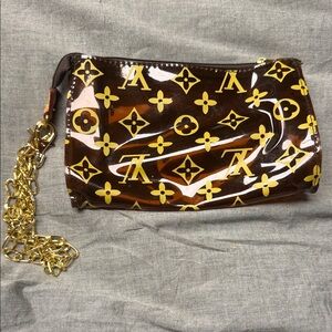 Brown and gold vinyl pouchette